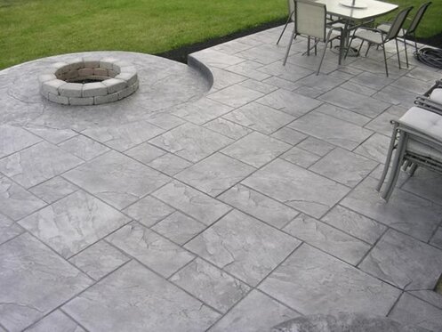 Ashlar slate stamped concrete patio with firepit