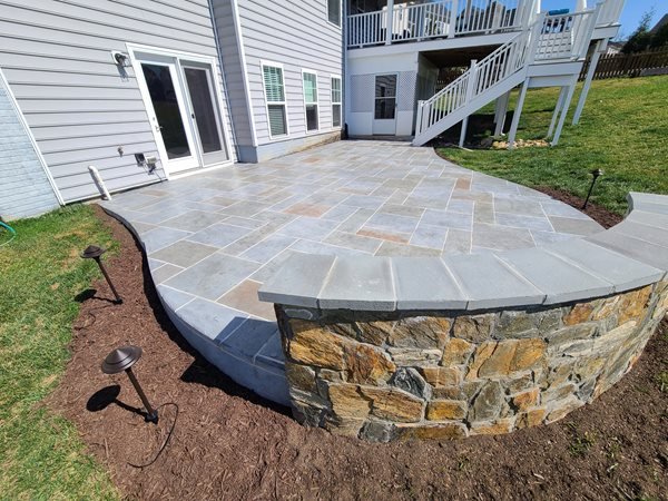 Stamped concrete patio with knee wall